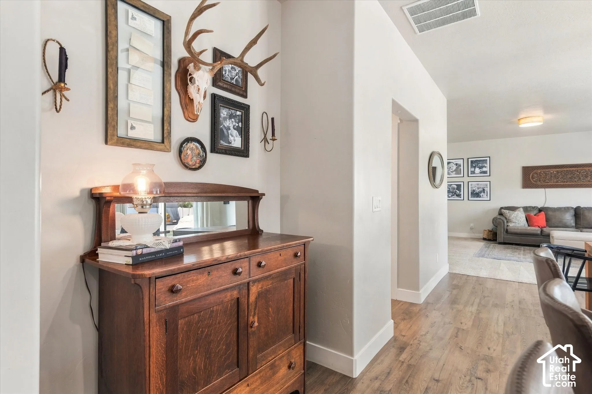 Recessed entry with wood-finish flooring, neutral wall tones, and white trim