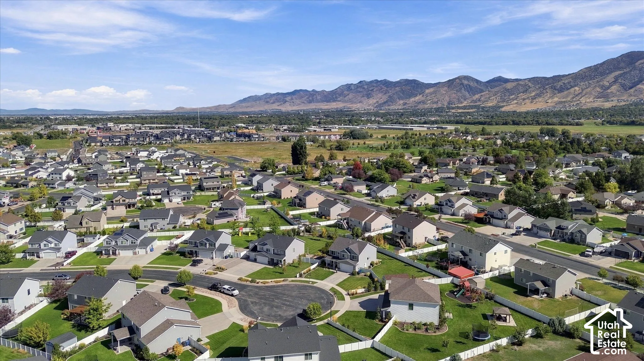Expansive residential neighborhood with distant mountain ranges