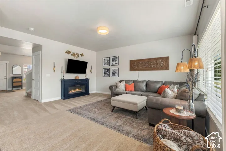 Recessed lighting, wood-finish flooring, and a built-in fireplace