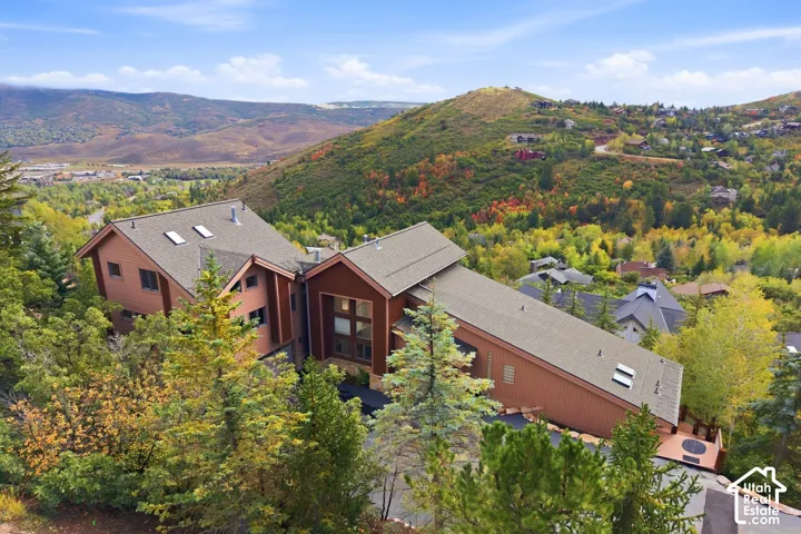 Multi-level brown-sided exterior with a sloped roofline
