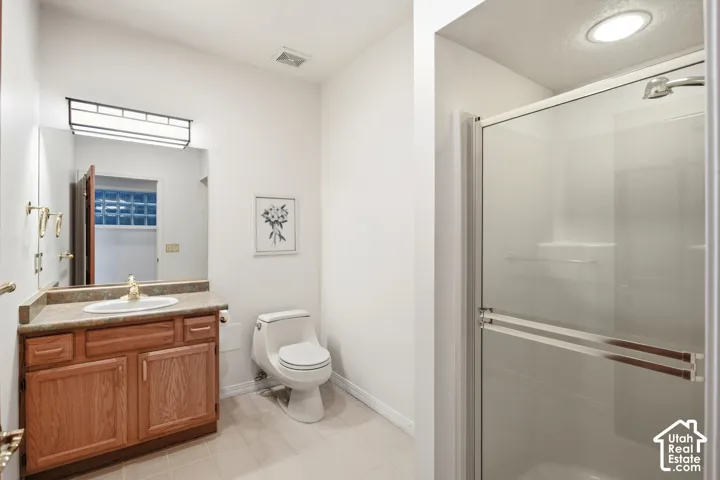 Wood-finish vanity with an integrated sink and countertop