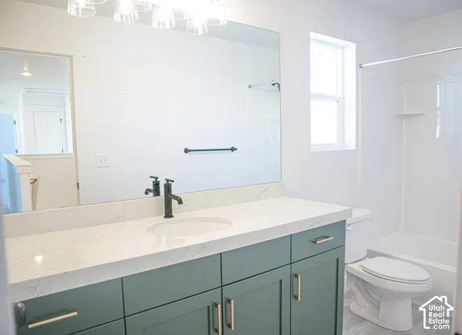 Full secondary bath with painted wood cabinets and quartz slab countertops.