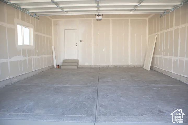 Two-car garage with taped finish.