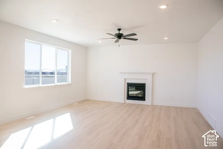 Large family room with great windows, built-in fireplace, 9' ceiling and ceiling fan.