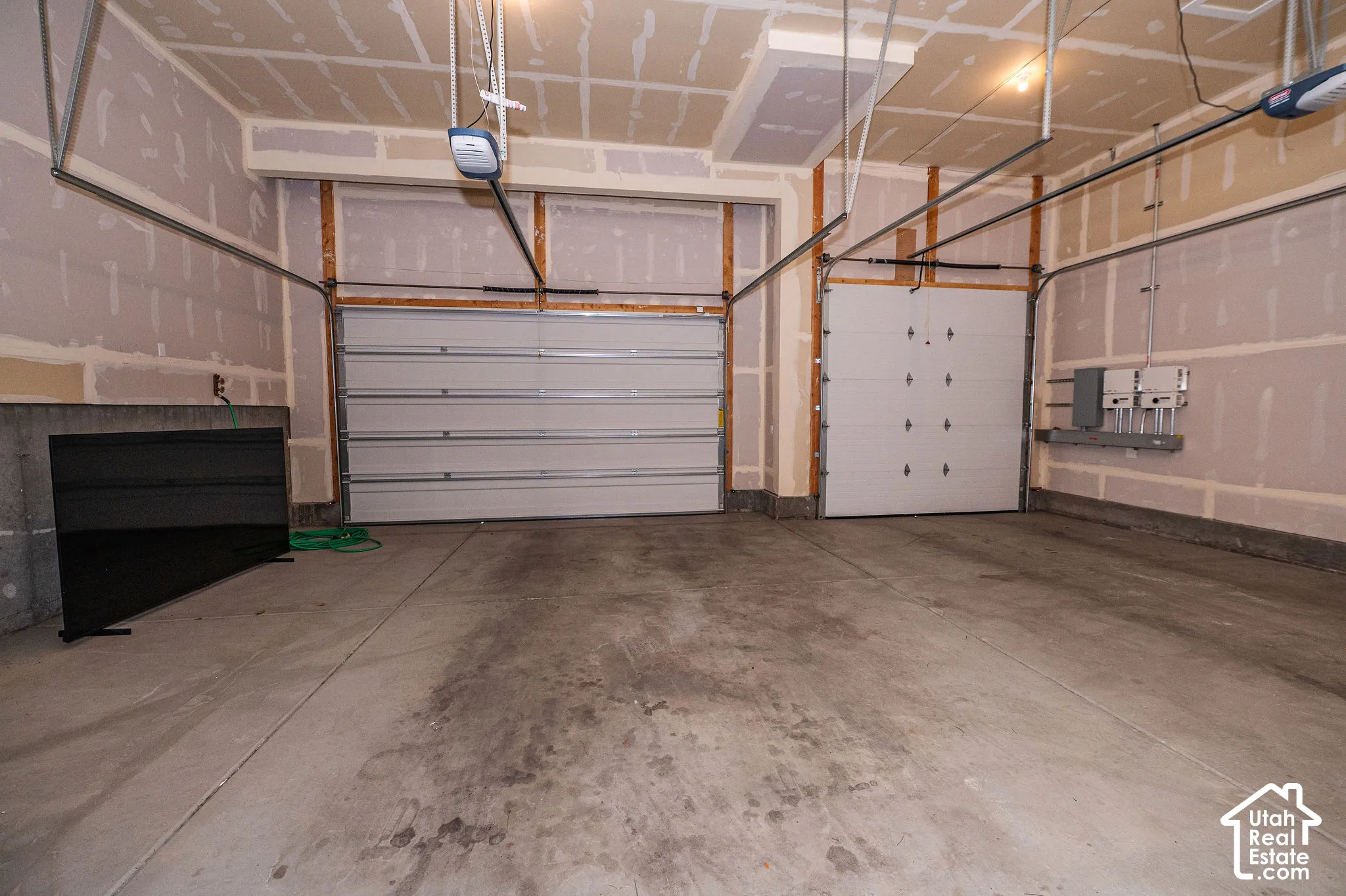 Two overhead garage doors with automatic openers