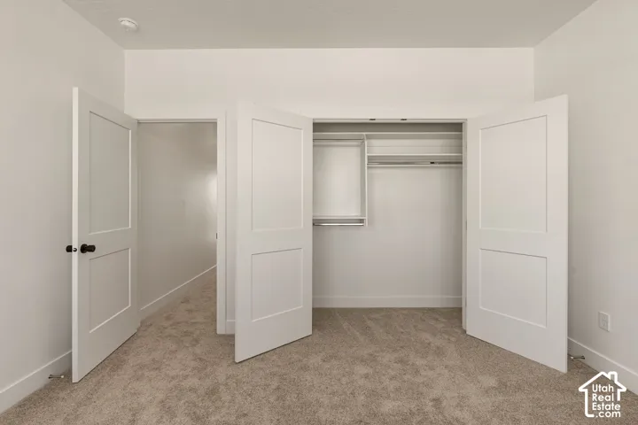 Built-in closet with shelving and hanging rods