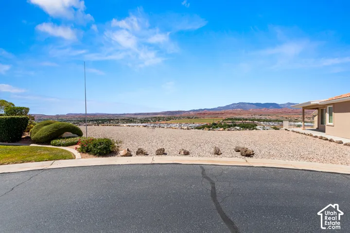 Expansive gravel landscape with distant mountain scenery