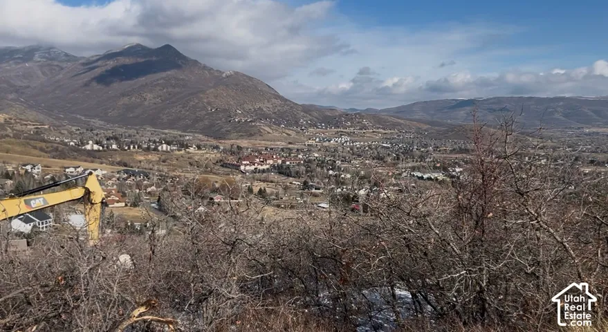 Expansive mountain scenery with distant townscape