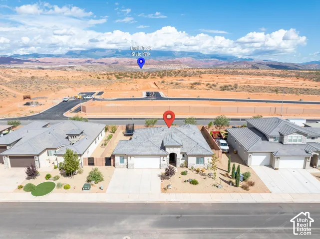 Single-story residence featuring a gray-toned roof and a two-car garage