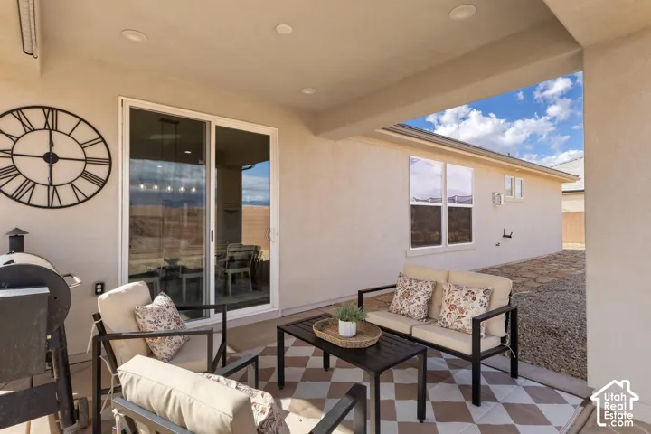Covered patio featuring recessed lighting and sliding glass door access