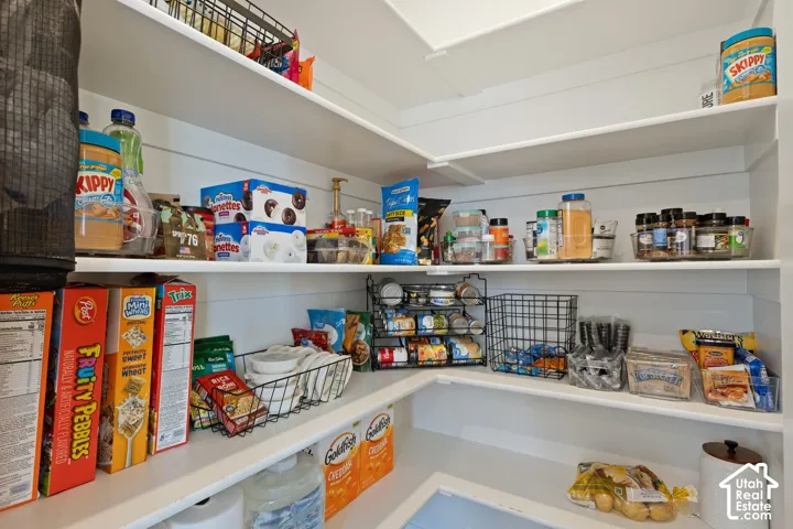 Built-in shelving with white finishes and ample storage capacity