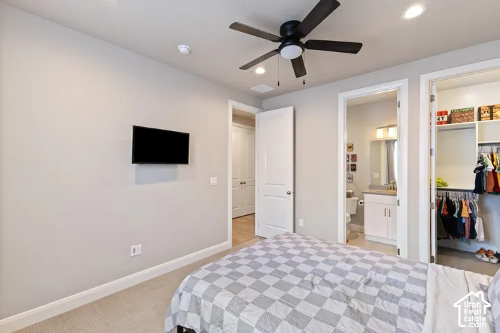 Recessed lighting, ceiling fan, and carpeted flooring