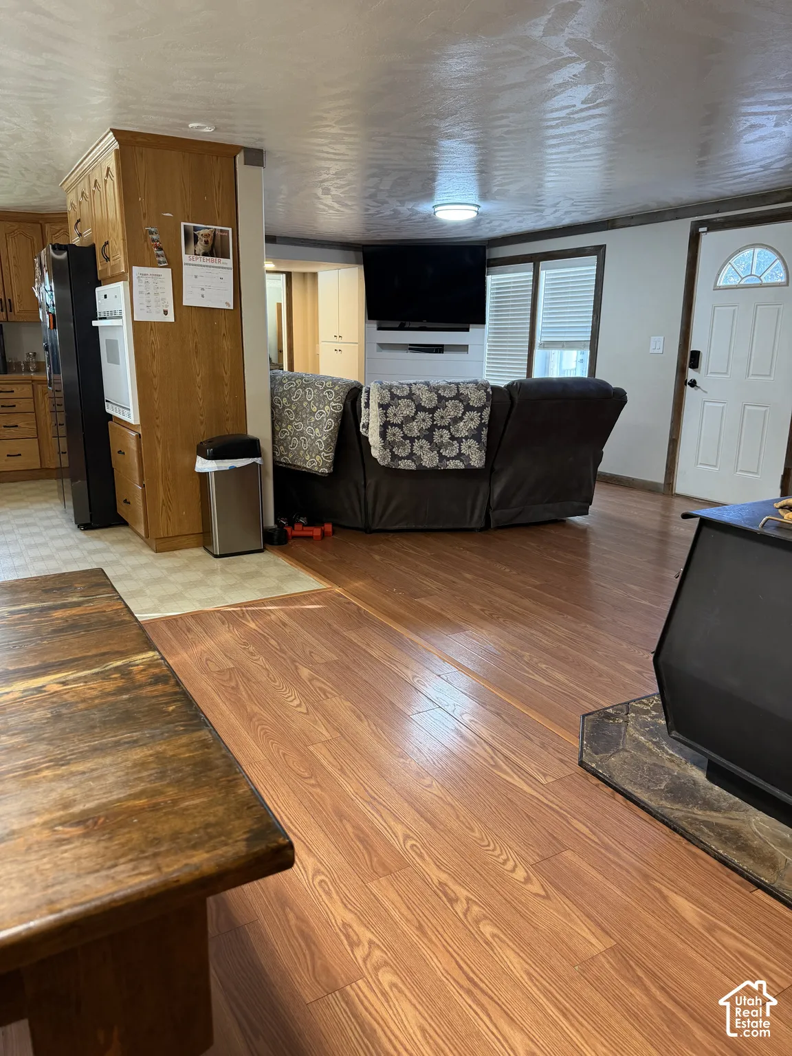 Wood-finish flooring, built-in wall oven, and built-in wood cabinetry