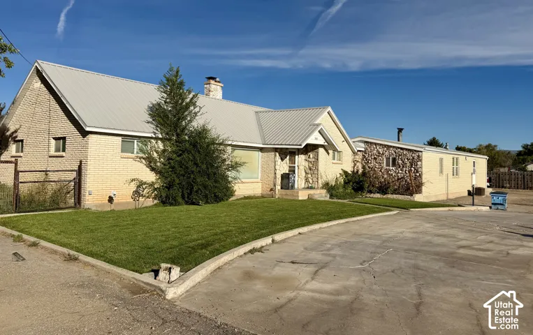 Brick and stone exterior with a metal roof
