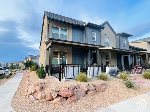 Contemporary exterior featuring a covered porch, durable siding, and a gabled roofline