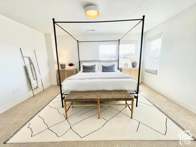 Light-colored wall finishes, recessed windows, and flush-mount ceiling lighting
