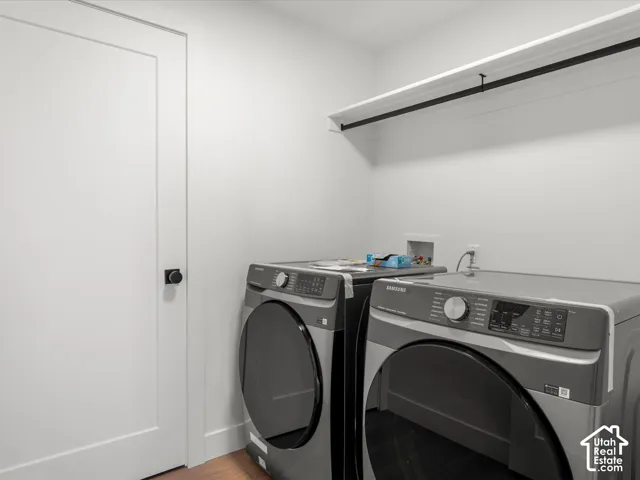 White walls with a contrasting black wall-mounted shelf