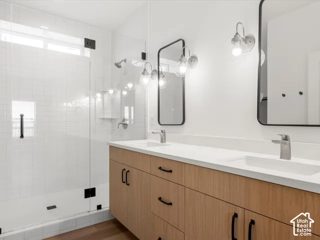 Dual vanity with wood-finish cabinetry and integrated sinks