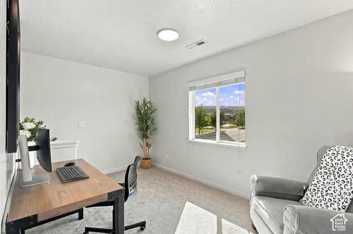 Recessed ceiling lighting, window with a broad sill, and light-toned wall finishes