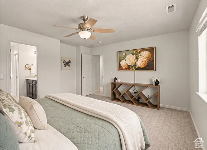 Virtually Staged. Neutral wall-to-wall carpeting, brushed-nickel ceiling fan with integrated lighting, and multi-panel interior doors