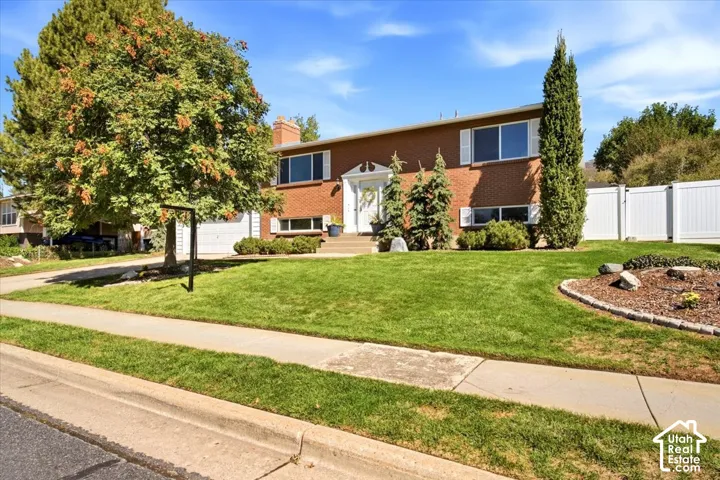 Brick exterior with white window shutters