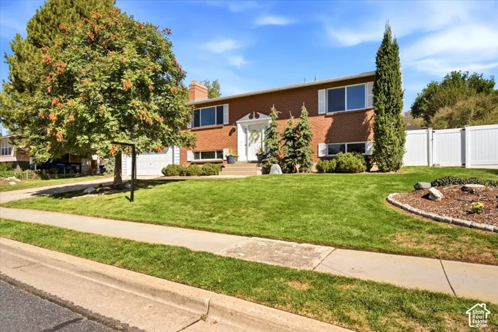 Brick exterior with white window shutters