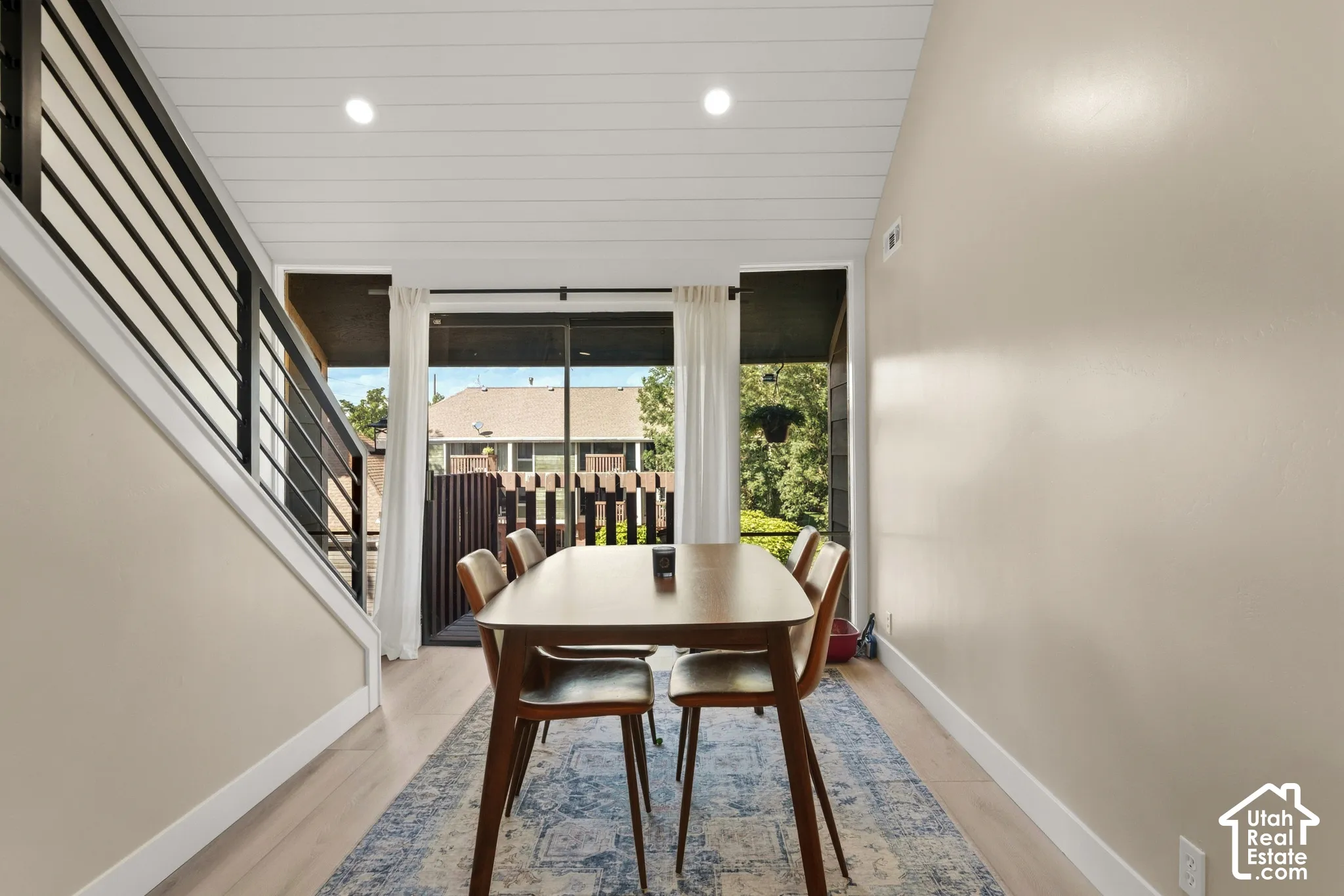Recessed lighting illuminates the shiplap ceiling