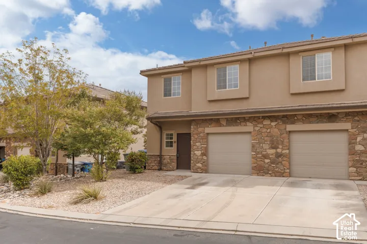 Stucco exterior with stone veneer accents