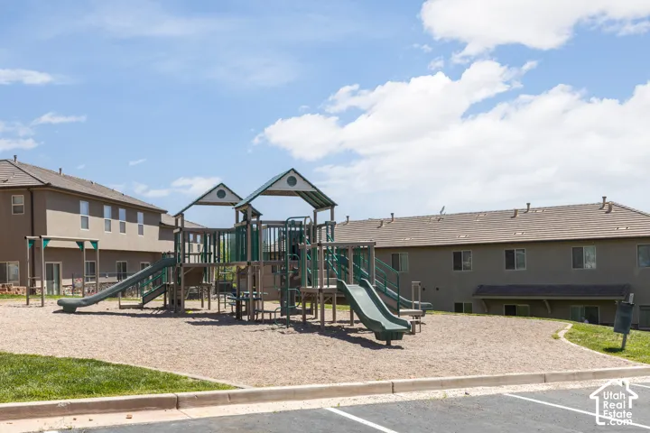 Community playground featuring multiple slides and climbing structures