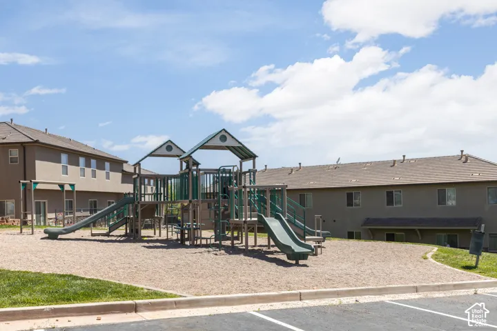 Community playground featuring multiple slides and climbing structures