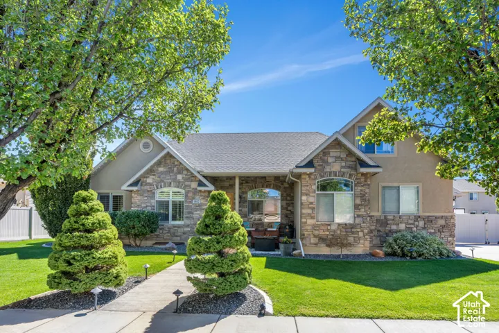 Stone and stucco exterior with a gabled roofline