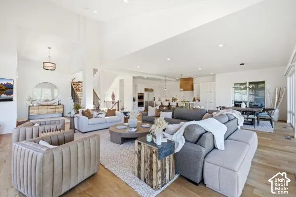 Vaulted ceilings, wood-finish flooring, recessed lighting, built-in kitchen cabinetry, and large sliding glass doors. The photos are renderings only - these photos are for a similar unit in Discovery Ridge. Not this actual model.
