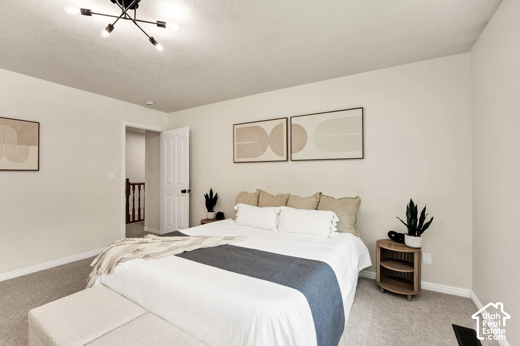 Neutral wall tones complemented by light gray carpeting