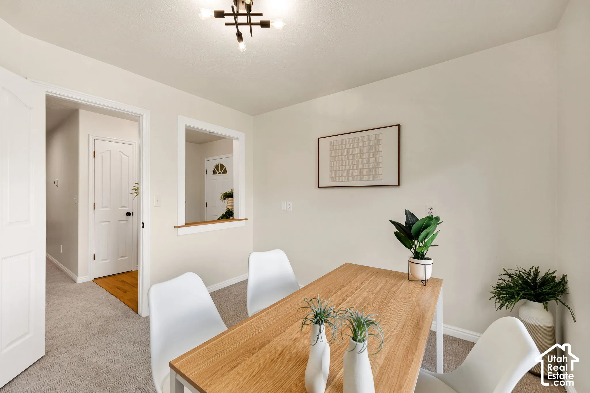 Recessed lighting, wood-finish flooring, and light-toned wall finishes