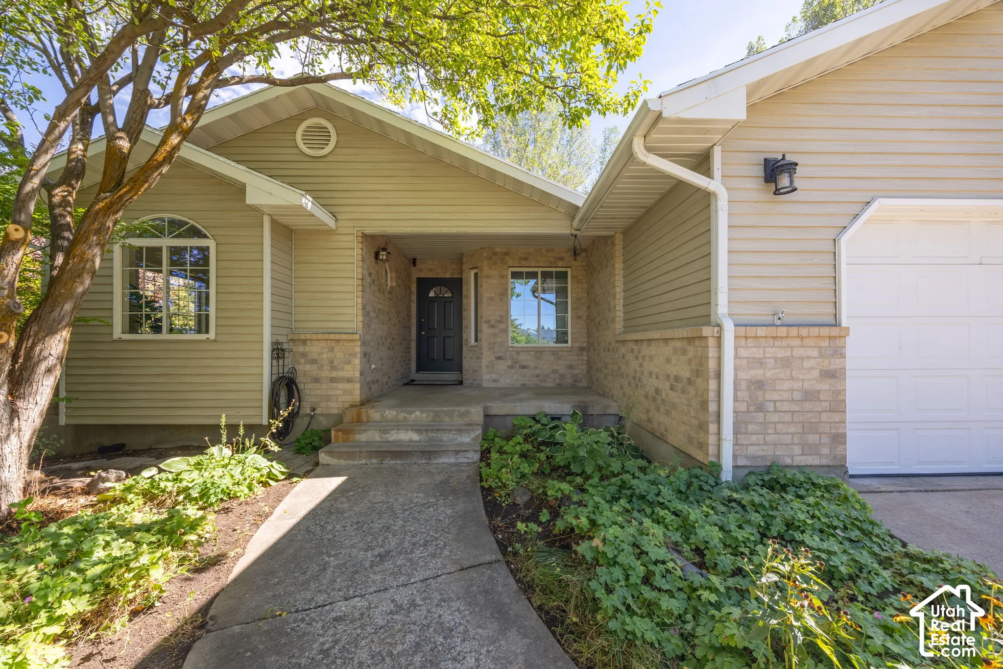 Brick and siding exterior with covered porch entry