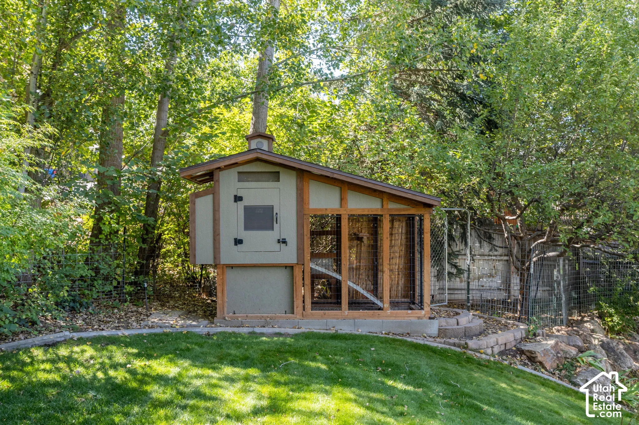 Custom-built coop with a ventilated enclosure, elevated design, automatic lighting, and integrated run