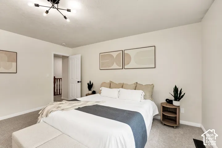Neutral wall tones complemented by light gray carpeting