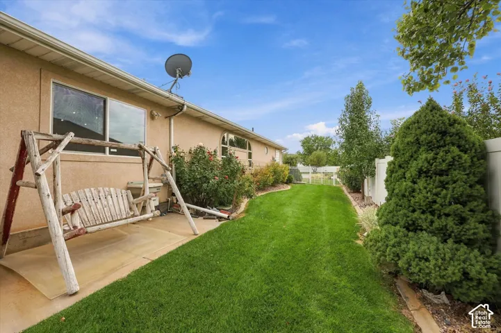 Expansive lawn area with mature trees and established landscaping