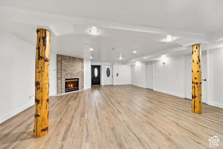 ADU Basement - Spacious room featuring wood-finish flooring, recessed lighting, and white walls