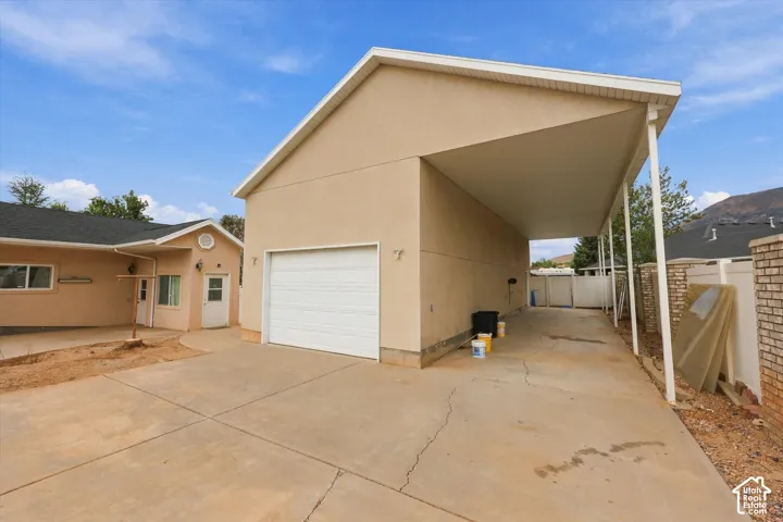 Attached garage with a white overhead door