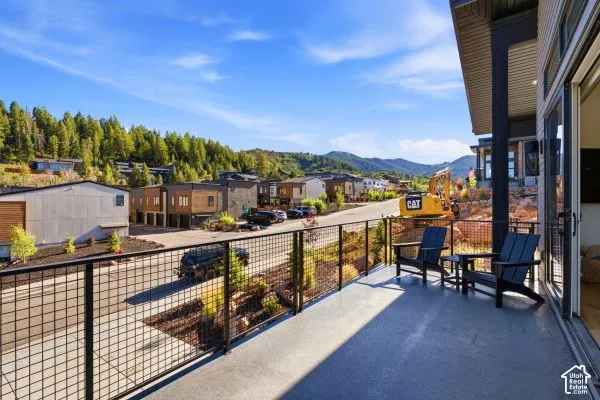 Private balcony with a grid-pattern metal railing