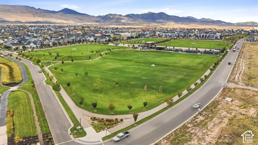 Expansive green spaces featuring manicured lawns and walking paths