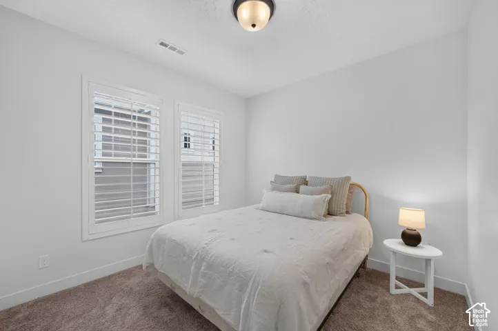 Dual windows featuring white plantation shutters
