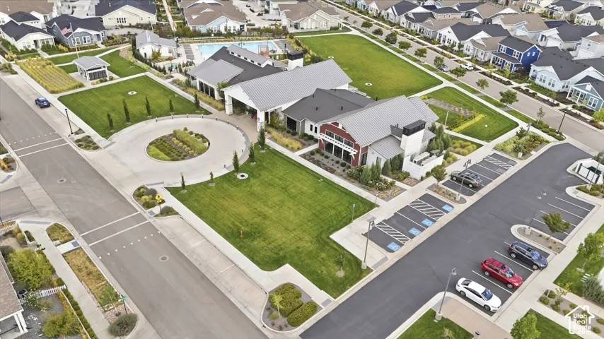 Community amenities featuring a central lawn, swimming pool, and dedicated parking areas