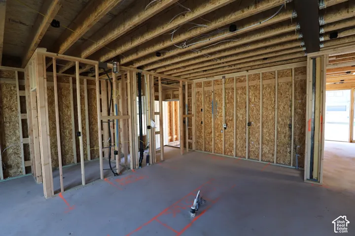 Framed interior walls with exposed electrical wiring and plumbing rough-ins