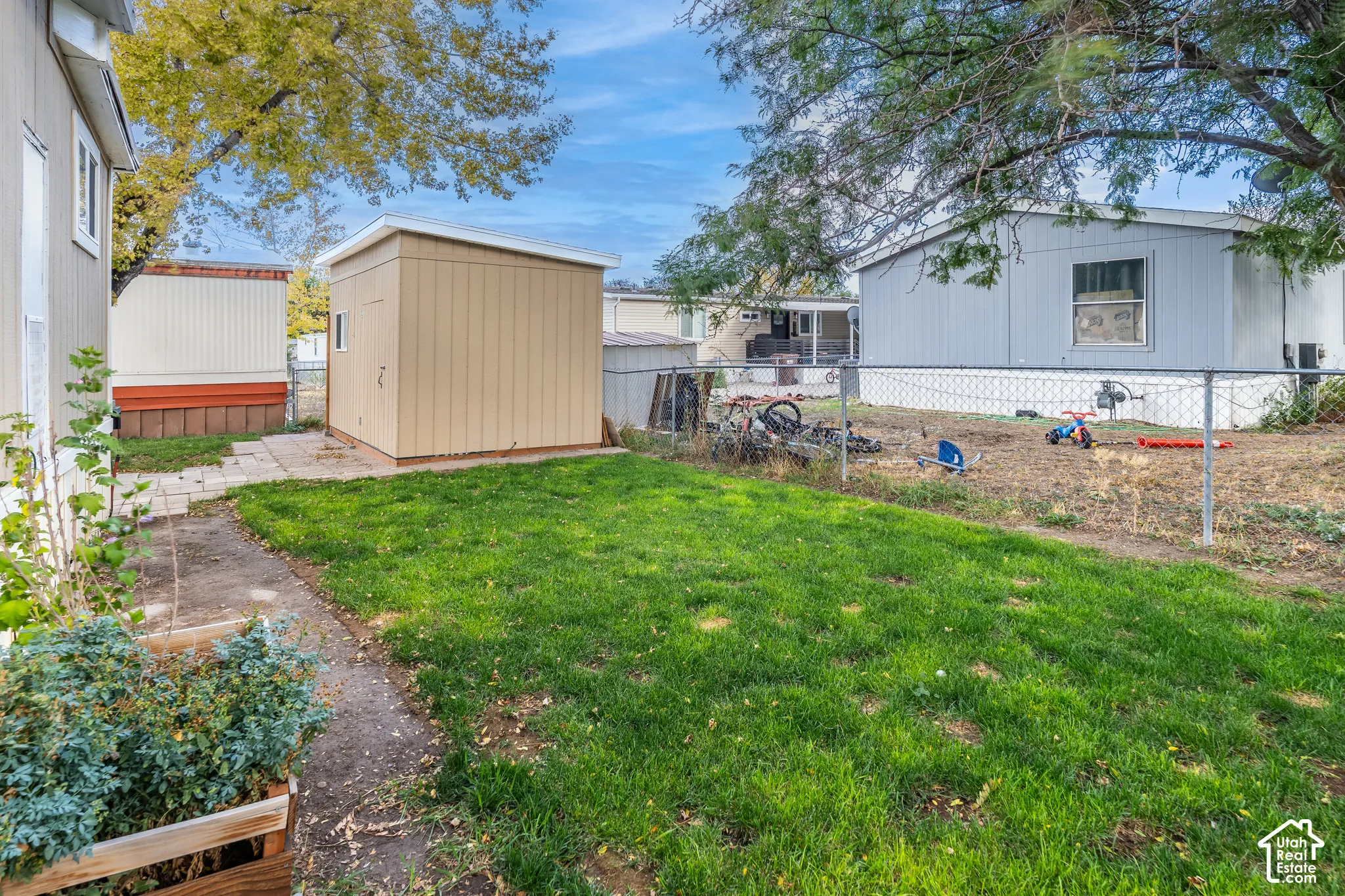 Lawn area with a detached storage shed