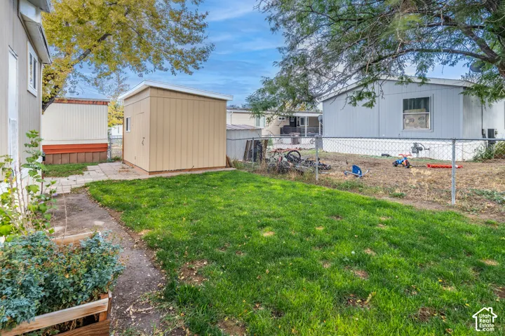 Lawn area with a detached storage shed