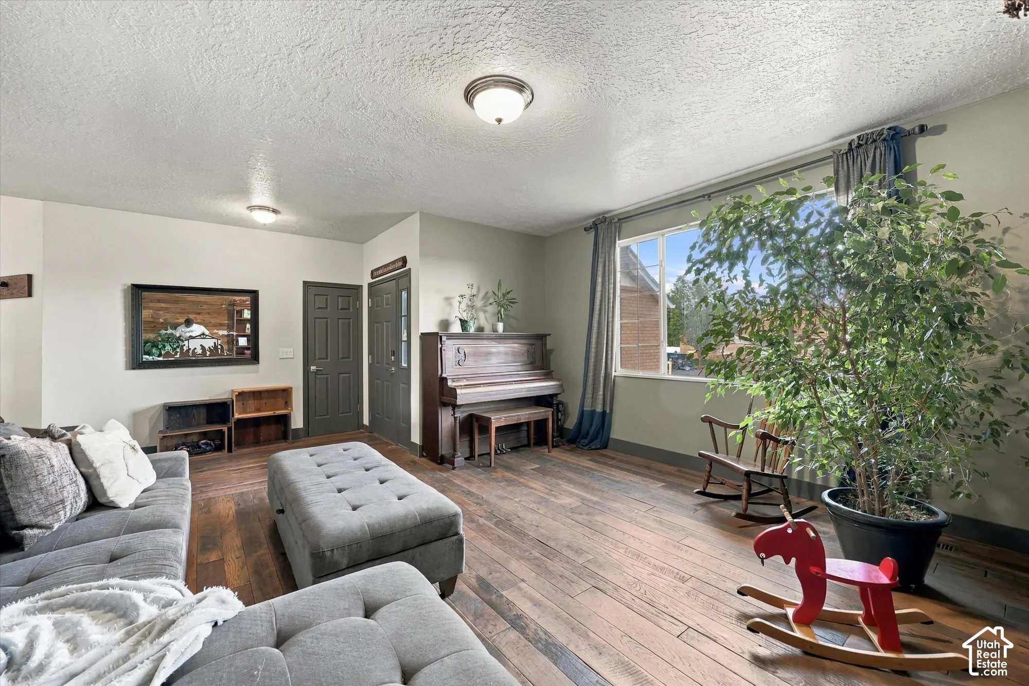 Hardwood flooring throughout and a large window.