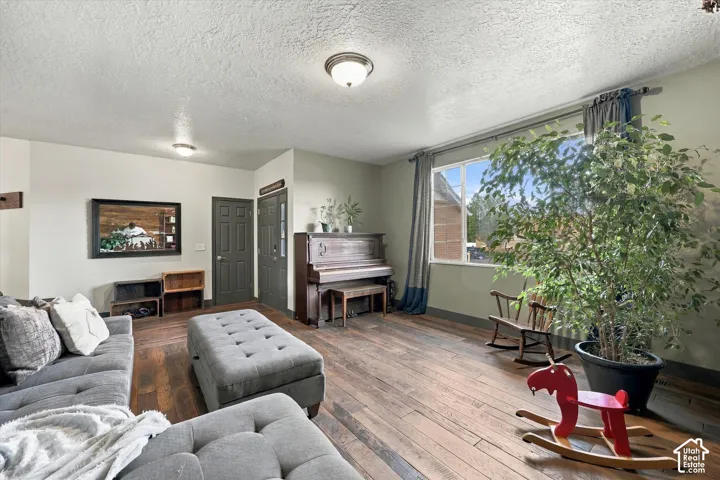 Hardwood flooring throughout and a large window.