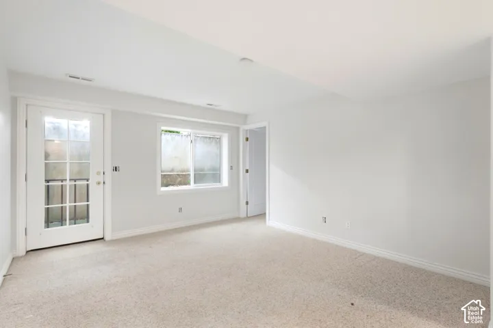 Mother in law, Neutral carpeted flooring with white painted walls